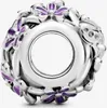 A silver charm with purple floral accents. Produktbild-Vorschau