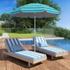 Two lounge chairs with striped cushions are set up on a wooden deck next to a swimming pool, with a striped umbrella providing shade. Náhled obrázku produktu