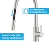 A close-up of a kitchen faucet with a pull-out hose, highlighting its features with text overlays. Produktbild-Vorschau