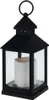 A black metal lantern with a white LED candle inside, set against a white background. Náhled obrázku produktu
