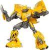 A yellow and gray robot action figure, Bumblebee from Transformers, is posed dynamically against a white background. Produktbild-Vorschau