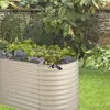 A raised garden bed filled with plants in a garden setting. Produktbild-Vorschau