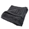 A folded dark gray towel is shown against a white background. Produktbild-Vorschau