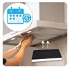 A person is shown installing a charcoal filter into a kitchen range hood. Produktbild-Vorschau