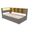 A product shot of a daybed with a bookshelf headboard. Voir les images du produit