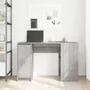 A desk with a laptop and some office supplies on it, in a room with a shelf and a pegboard. Náhled obrázku produktu