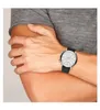 A person wearing a watch on their wrist. Produktbild-Vorschau