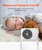 A sleeping baby next to an air conditioner unit on a stand. Podgląd zdjęcia produktu