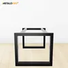 A black metal table base on a wooden floor against a white wall. Anteprima dell’immagine prodotto