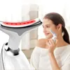 A woman is using a facial toning device, with the device itself prominently displayed in the foreground. Náhľad obrázku produktu