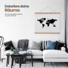 A modern living room with a white sectional sofa, coffee table, and a world map poster hanging on the wall. Produktbild-Vorschau