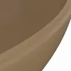A close-up view of the edge of a cream-colored ceramic sink. Náhled obrázku produktu