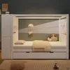 A child's bed with storage and a canopy, decorated with stuffed animals and a decorative camera. Produktbild-Vorschau