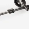 Close-up of a metal tube with a black plastic clamp on it, part of a wheeled cart. Produktbild-Vorschau