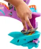 A child's hand is shown interacting with a toy skateboard set, demonstrating a trick on a shark-shaped ramp. Náhled obrázku produktu