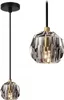 A product shot of a pendant lamp with a crystal shade and black cord. Podgląd zdjęcia produktu