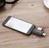 A smartphone connected to a USB-C card reader with SD and microSD cards inserted, placed on a wooden surface. Produktbild-Vorschau
