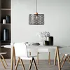 A dining room setting with a table, chairs, and a pendant light. Produktbild-Vorschau