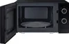 An open black microwave oven with its turntable inside. Anteprima dell’immagine prodotto