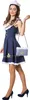 A woman wearing a sailor-themed dress and hat, posing with a handbag. Produktbild-Vorschau