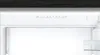 Interior of a refrigerator with a control panel at the top. Voir les images du produit