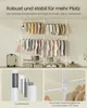 A collage showing a clothing rack with clothes, suitcases, and close-ups of product details. Produktbild-Vorschau