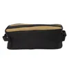 A side view of a black and tan storage bag. Podgląd zdjęcia produktu