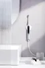A smart electric toothbrush is mounted on a wall in a modern bathroom setting. Náhled obrázku produktu