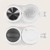 A top-down view of a baby food maker, showing two compartments. Produktbild-Vorschau