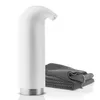 A white soap dispenser and a stack of gray towels on a white background. Anteprima dell’immagine prodotto
