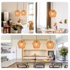Collage of kitchen and dining room scenes featuring rattan pendant lights. Produktbild-Vorschau