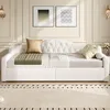 A white daybed with decorative pillows and a throw is shown in a well-lit room with decorative wall paneling and artwork. Anteprima dell’immagine prodotto