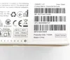 The image shows the side of a product box with various labels, barcodes, and symbols. Voir les images du produit