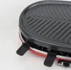 Close-up of a red raclette grill with a black griddle top. Produktbild-Vorschau