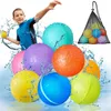 A boy in a blue wetsuit throwing a yellow ball, surrounded by colorful water-filled balls, with splashes of water all around. Produktbild-Vorschau