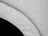 A close-up view of a textured fabric, possibly part of a pet bed or enclosure, with a dark background. Produktbild-Vorschau