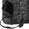A close-up view of a black backpack with a white abstract pattern, showing a smartphone partially inserted into an exterior pocket. Produktbild-Vorschau