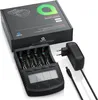 A black battery charger with four battery slots, a digital display, and control buttons, along with a black power adapter and its cable, are arranged on a white background. The product packaging is partially visible in the background. Produktbild-Vorschau