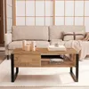 A coffee table in front of a sofa in a living room setting. Voir les images du produit