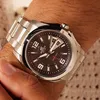 A close-up shot of a man's wrist wearing a silver Casio Edifice watch. Náhľad obrázku produktu