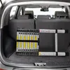 A telescopic ladder is stored in the trunk of a car. Produktbild-Vorschau