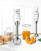 A Bosch hand blender set is displayed on a white countertop with ingredients and baked goods. Produktbild-Vorschau