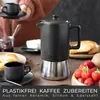 A breakfast scene featuring a coffee maker, croissants, jam, and strawberries. Produktbild-Vorschau