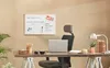 A home office setup with a whiteboard, desk, chair, and lamp. Voir les images du produit