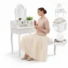 A woman applying makeup at a vanity table with a stool. Voir les images du produit