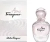 A perfume bottle and its box are displayed side-by-side against a white background. Produktbild-Vorschau