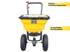 A yellow fertilizer spreader with a black cover and two large wheels, shown from the front. Produktbild-Vorschau