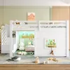 A child's bedroom with a white loft bed, decorated with stuffed animals and toys. Voir les images du produit