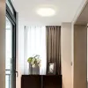A modern hallway with a ceiling light, curtains, and a vase of flowers on a cabinet. Anteprima dell’immagine prodotto