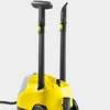 A close-up shot of a yellow and gray steam cleaner with two black extension wands attached. Produktbild-Vorschau